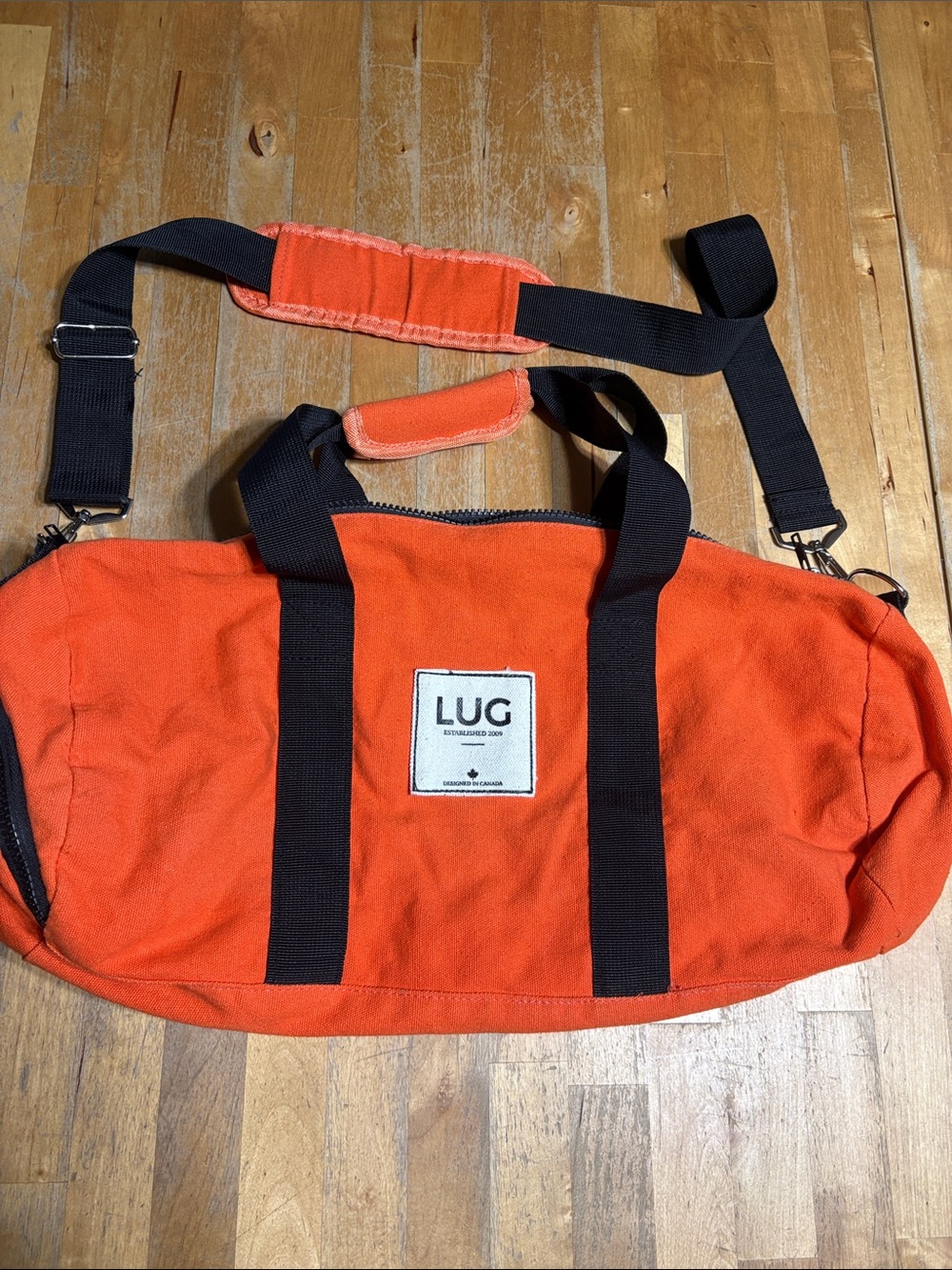 lug Orange Canvas Duffel Bag with Black Straps
